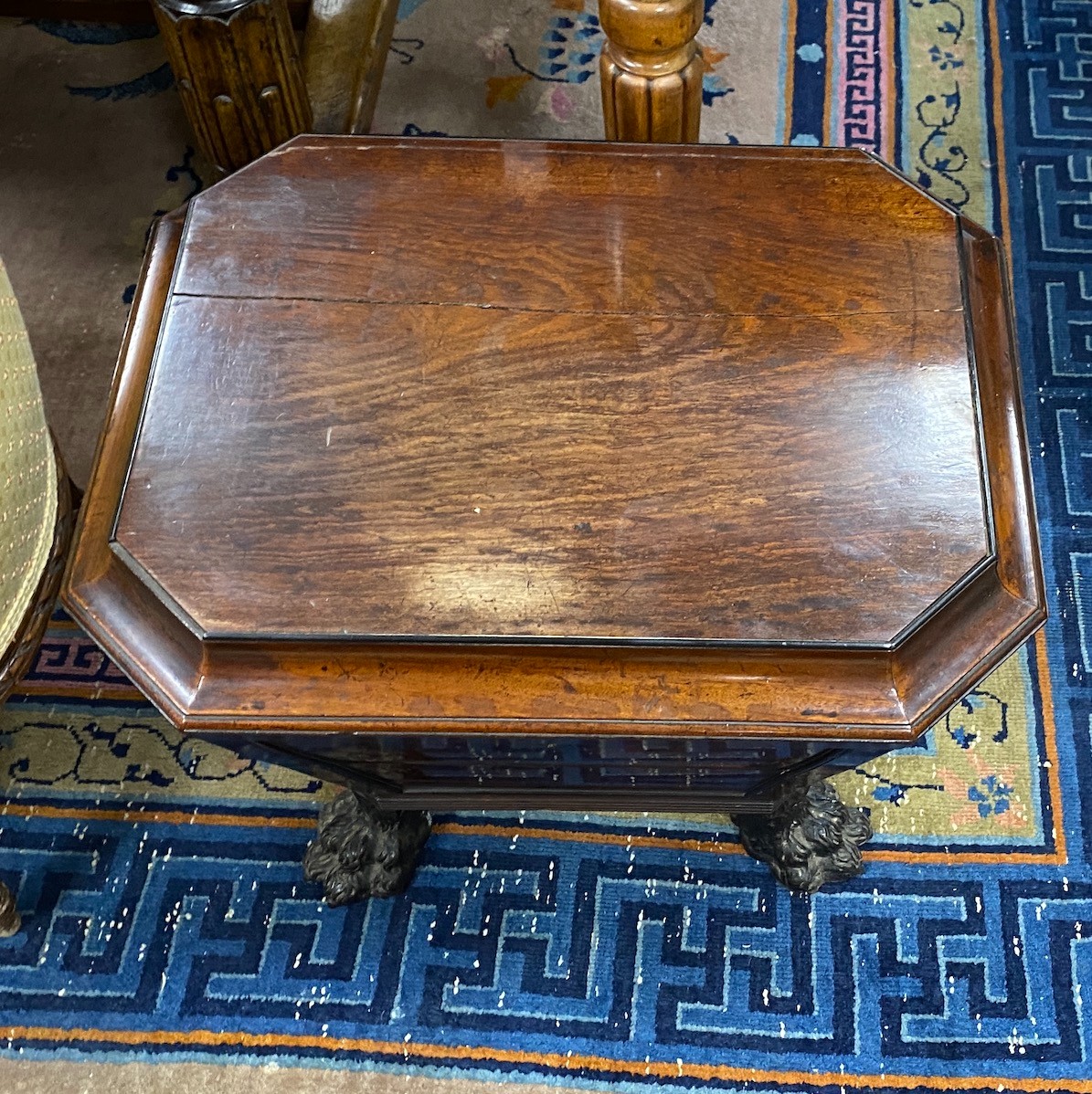 A Regency and later mahogany sarcophagus wine cooler on cast metal lions paw feet, width 56cm, depth 45cm, height 50cm.